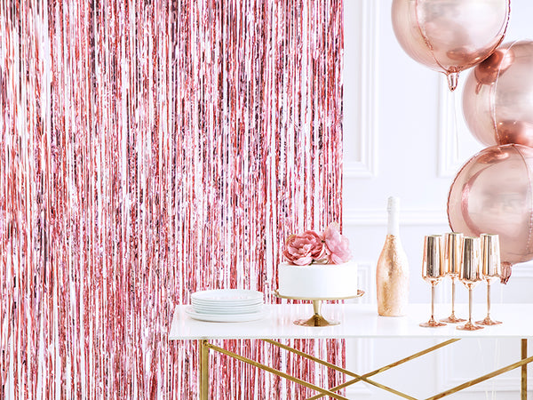 Rose Gold Fringe Curtain Party Backdrop perfect for a photo backdrop available at A Little Confetti