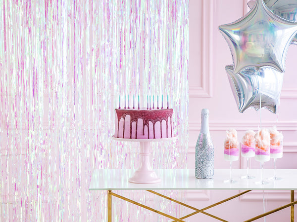 Beautiful iridescent fringe curtain backdrop available at A Little Confetti